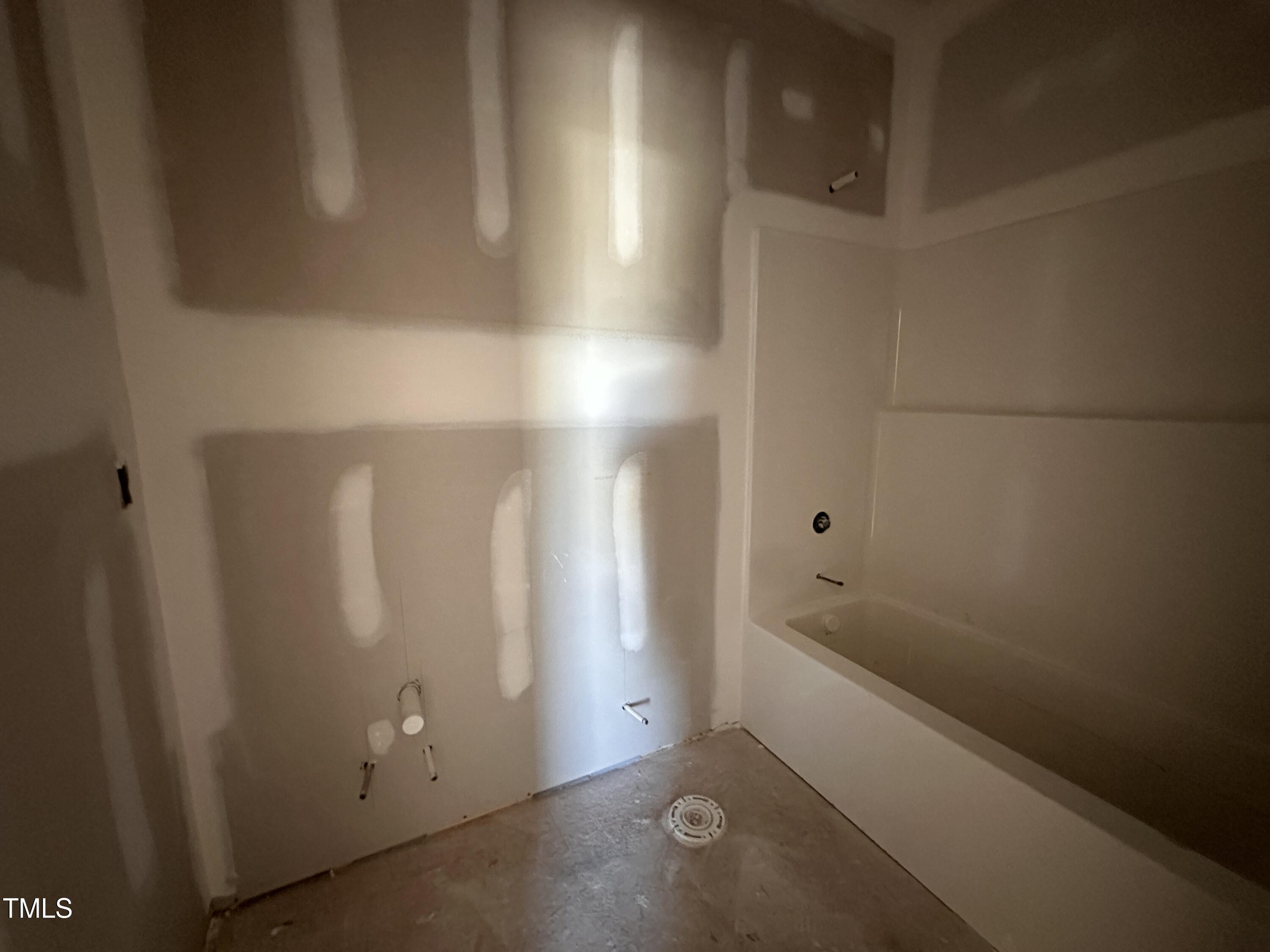 2895 Bakers Chapel Road Smithfield, NC 27577 - Photo 7 of 8 a bathroom with a tub and shower