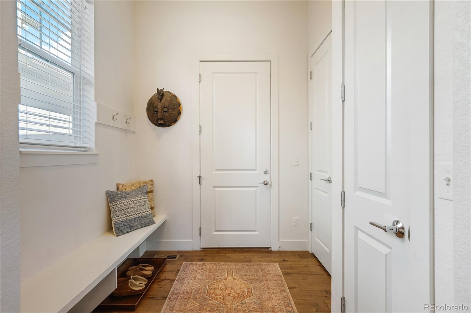 2027 Vallejo Loop Broomfield, CO 80023 - Photo 13 of 50 a view of room with window and hardwood floor