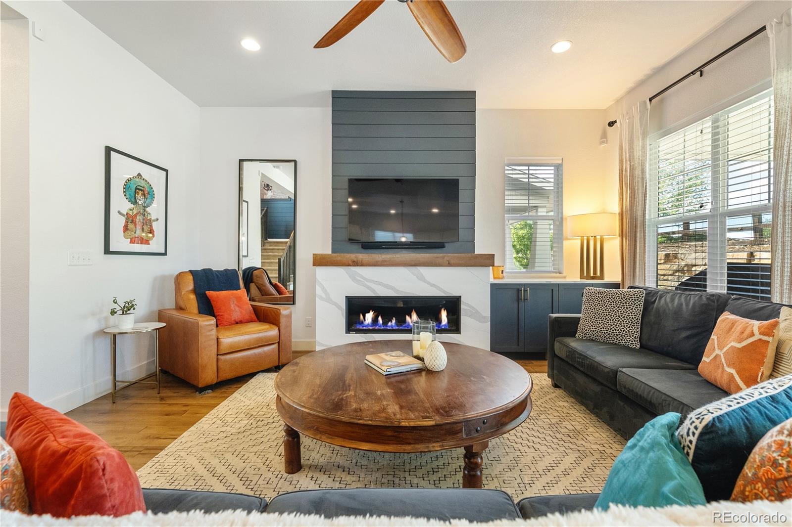2027 Vallejo Loop Broomfield, CO 80023 - Photo 15 of 50 a living room with furniture and a fireplace