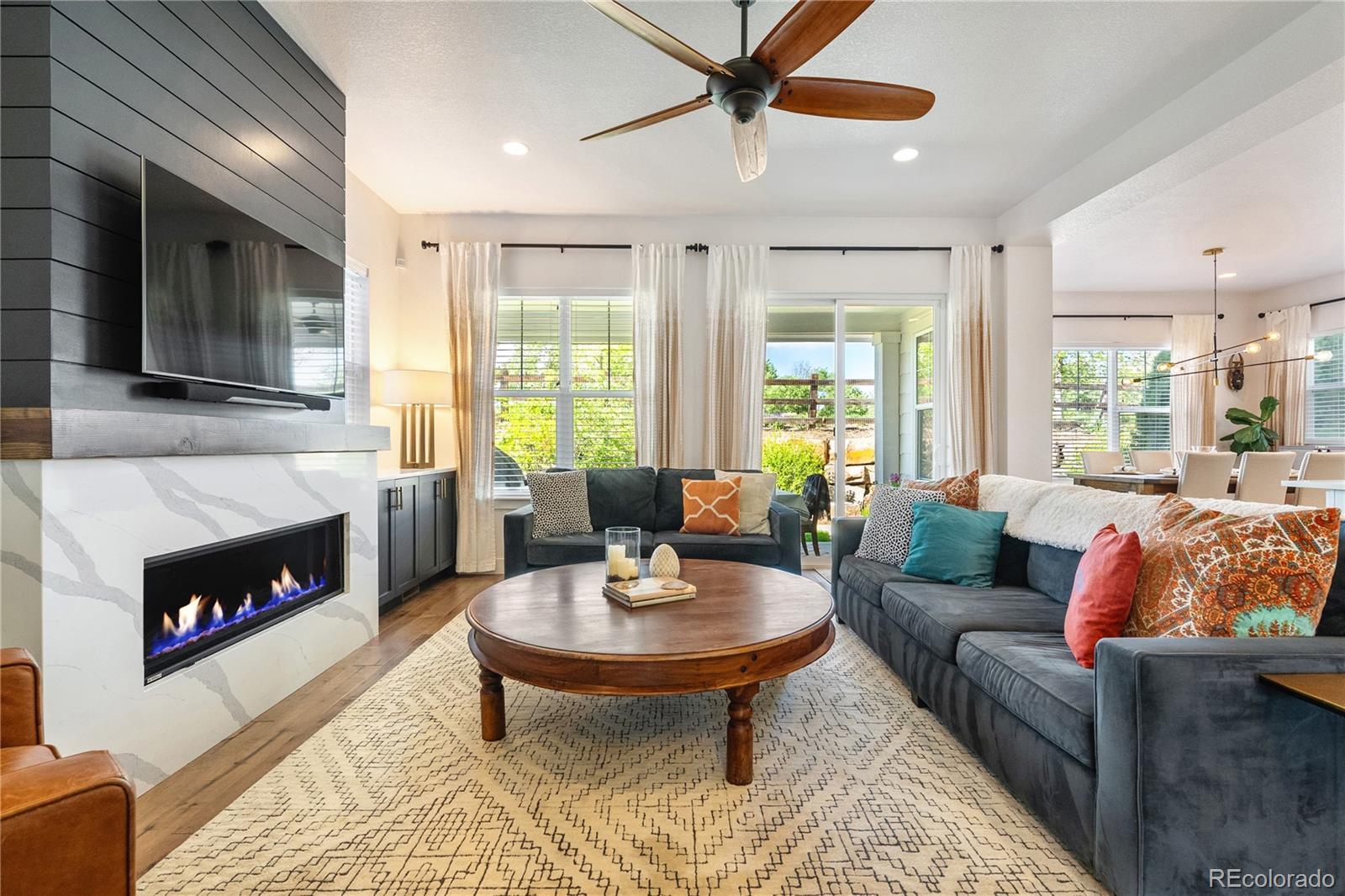 2027 Vallejo Loop Broomfield, CO 80023 - Photo 16 of 50 a living room with furniture and a fireplace