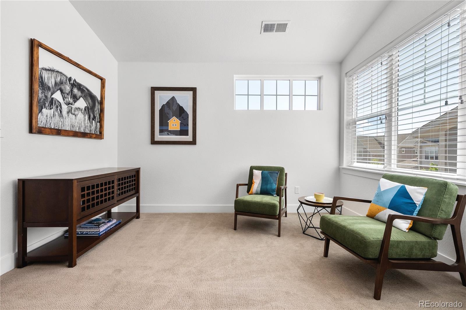 2027 Vallejo Loop Broomfield, CO 80023 - Photo 21 of 50 a living room with furniture and a window