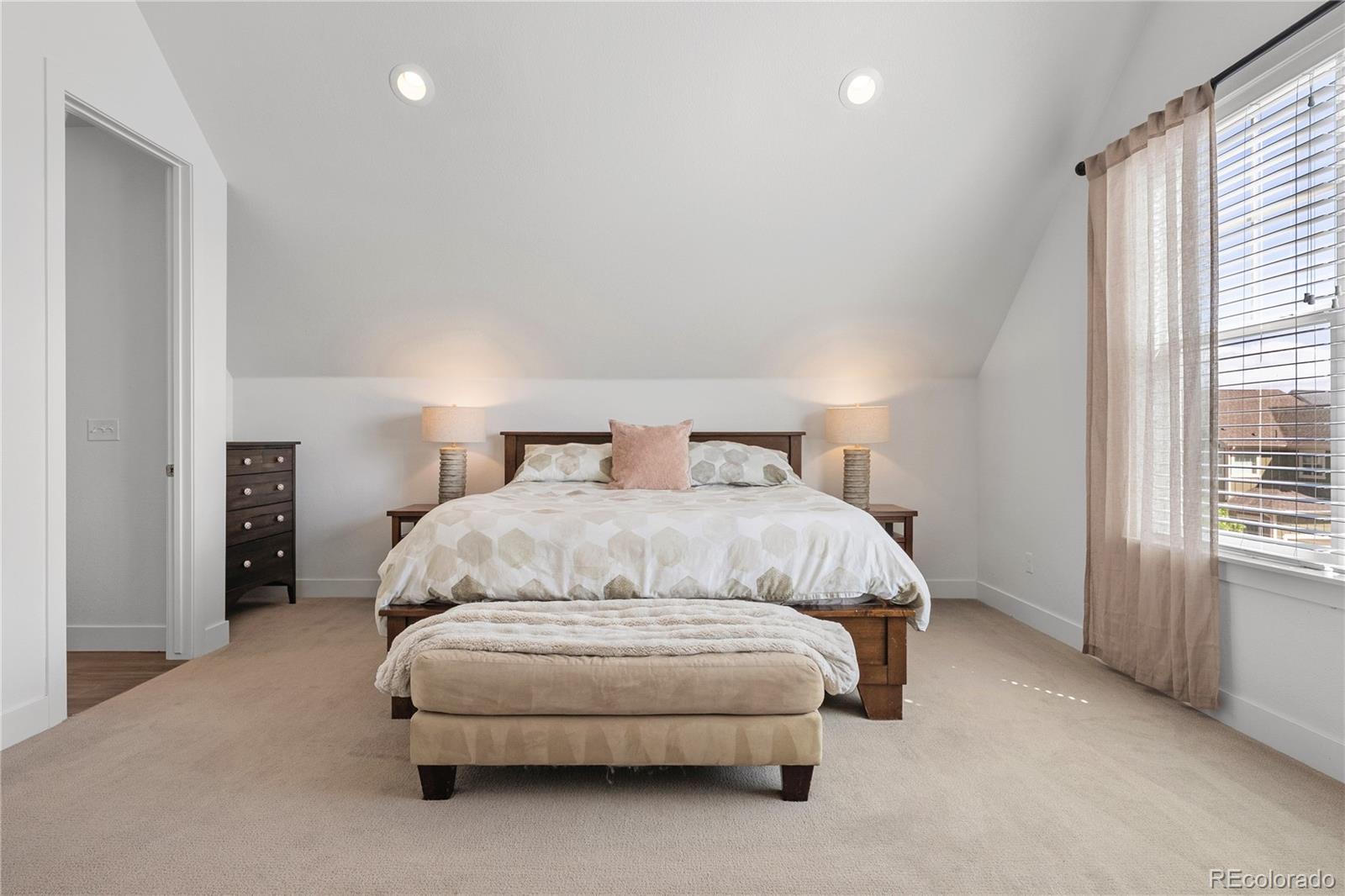 2027 Vallejo Loop Broomfield, CO 80023 - Photo 23 of 50 a bedroom with a bed and a window