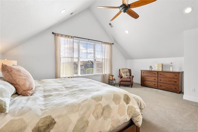 a bedroom with a bed dresser and a window