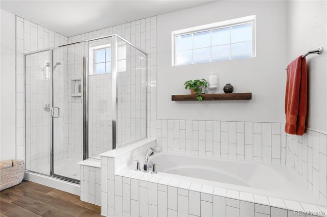 a bathroom with a bathtub and a shower