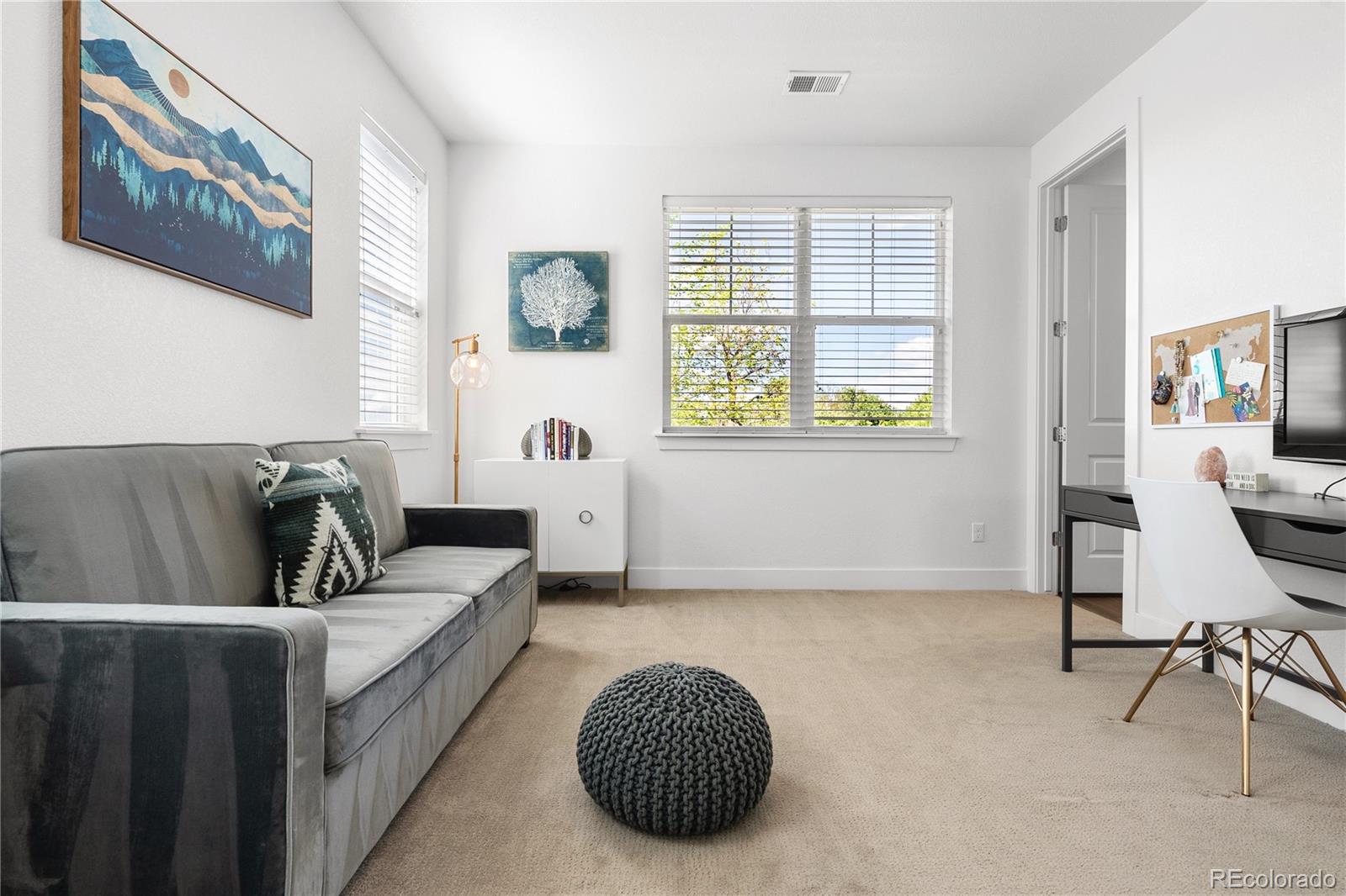 2027 Vallejo Loop Broomfield, CO 80023 - Photo 29 of 50 a living room with furniture and a window