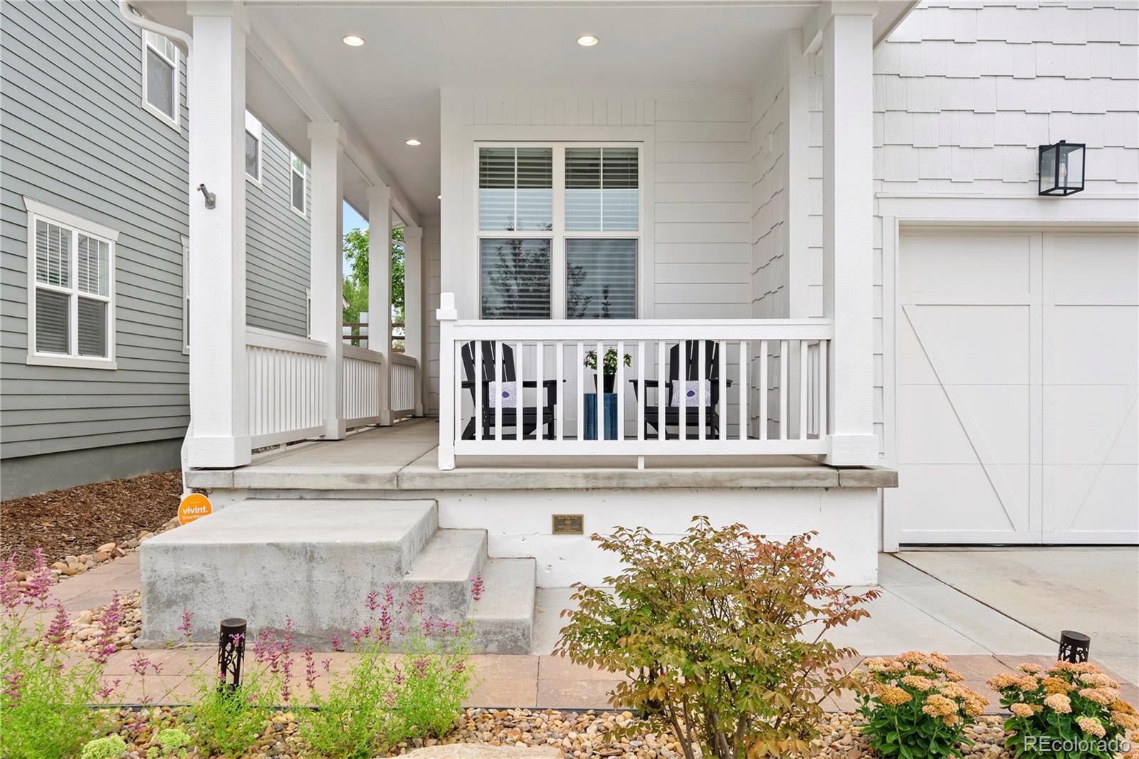 2027 Vallejo Loop Broomfield, CO 80023 - Photo 3 of 50 a view of a brick house with a small yard