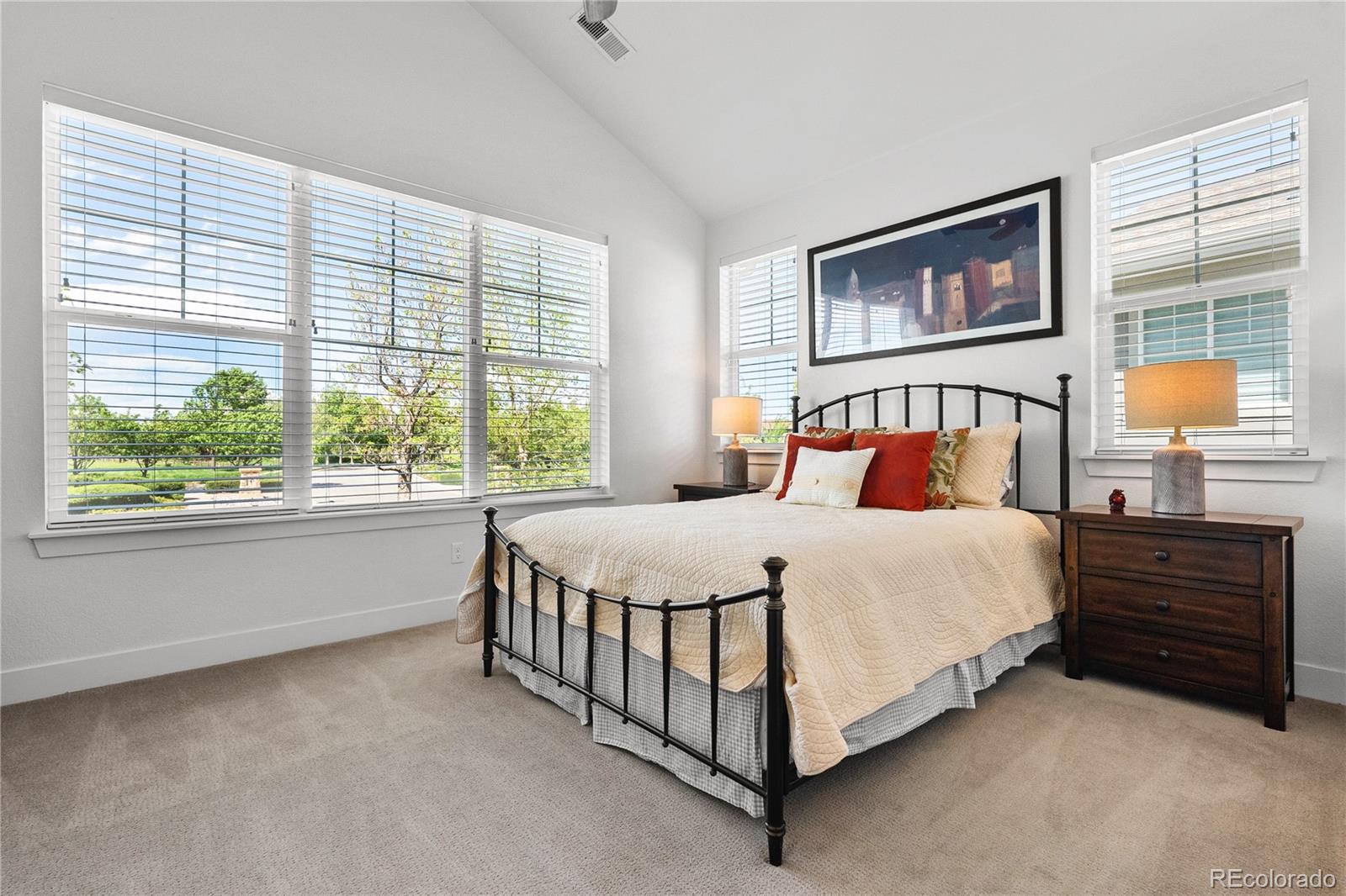 2027 Vallejo Loop Broomfield, CO 80023 - Photo 31 of 50 a bedroom with a bed lamp and window