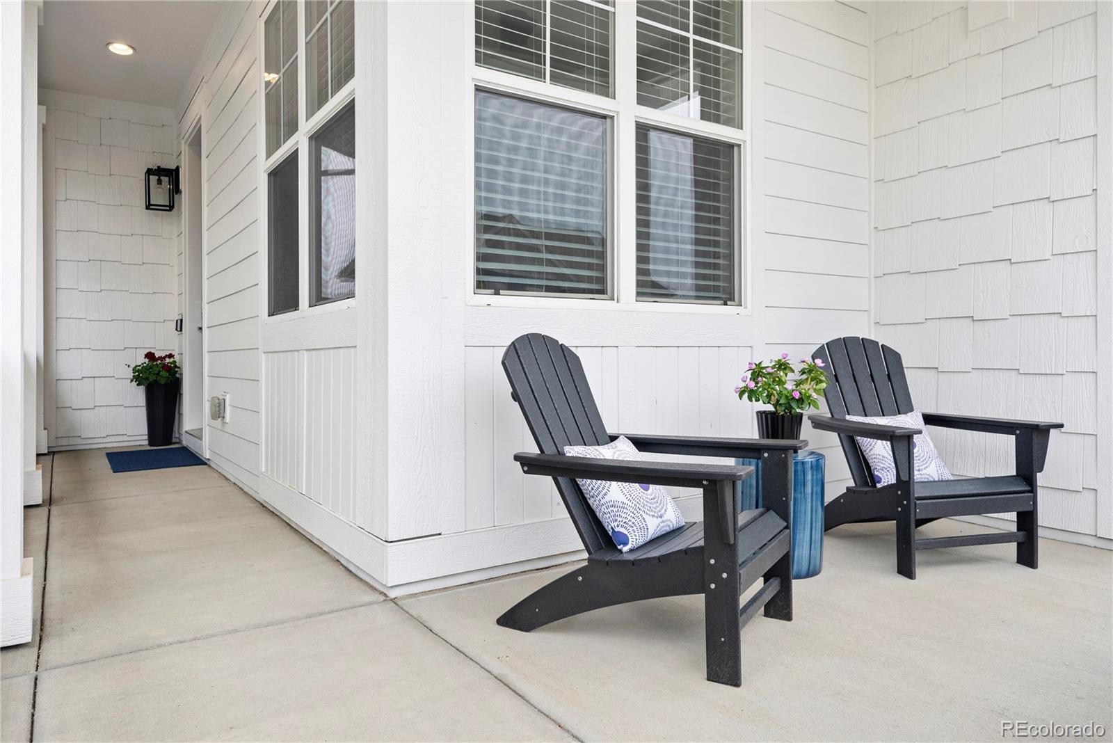 2027 Vallejo Loop Broomfield, CO 80023 - Photo 4 of 50 a view of a chair and table in the back yard of the building