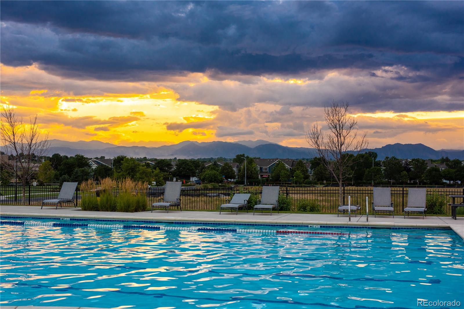 2027 Vallejo Loop Broomfield, CO 80023 - Photo 44 of 50 a view of a lake with houses in the back