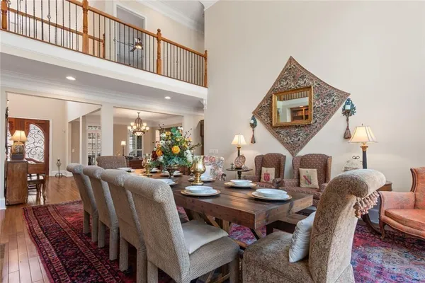 a living room with furniture ceiling fan and a flat screen tv