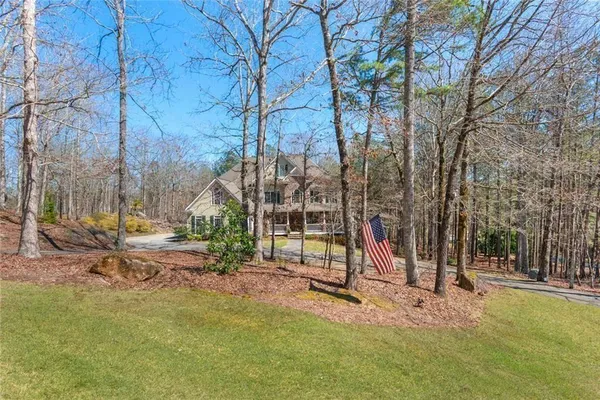 a view of a livingroom with furniture window and wooden floor
