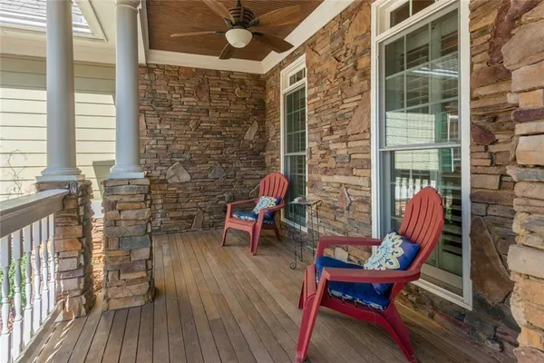 a living room with furniture a fireplace and a table