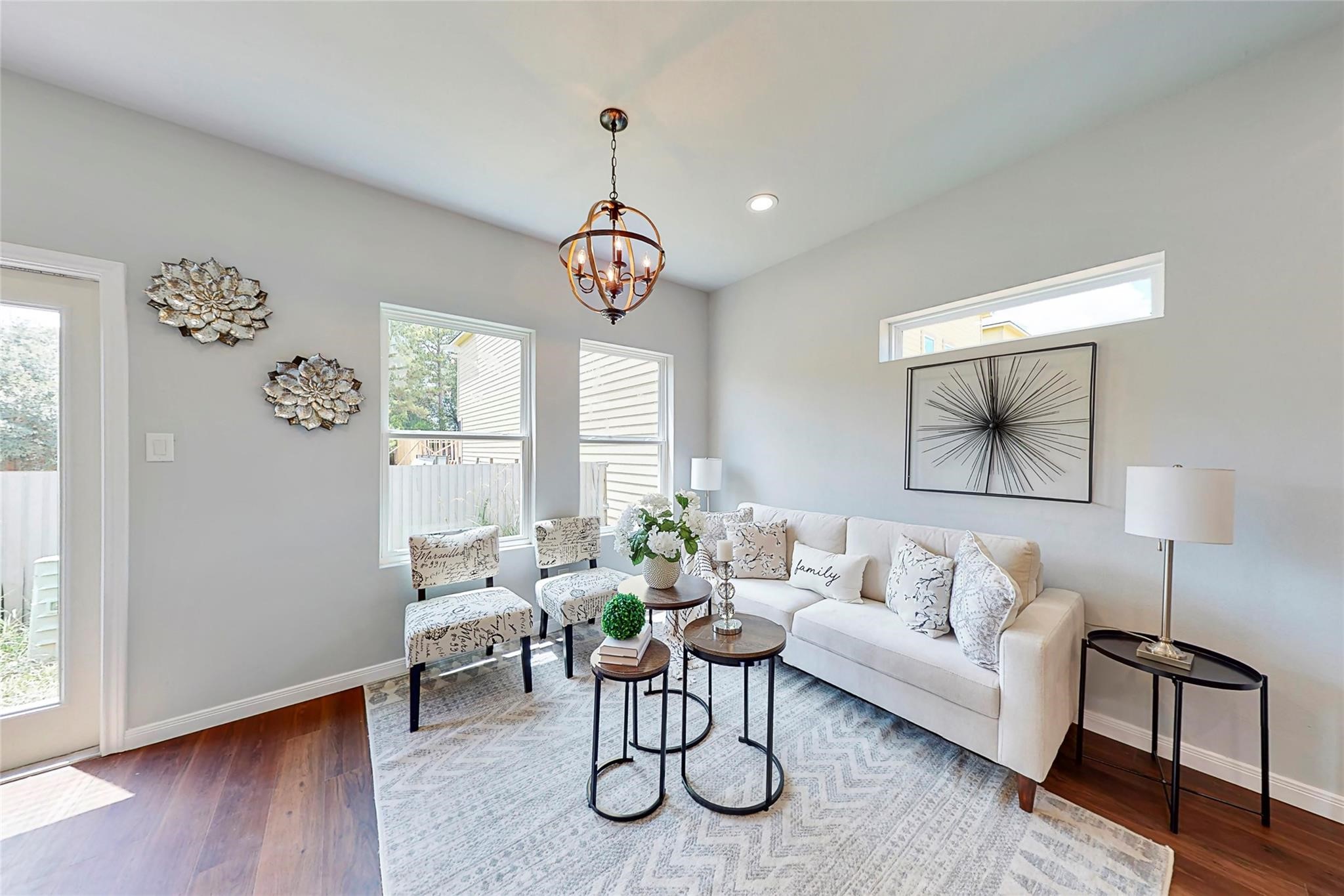 18813 Luminescent Lane Spring, TX 77379 - Photo 7 of 19 a living room with furniture a window and a chandelier
