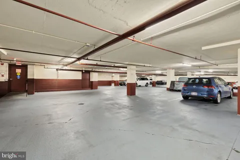 a view of parking garage with cars