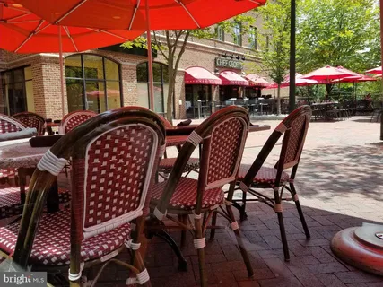 a view of a chairs and tables in the patio