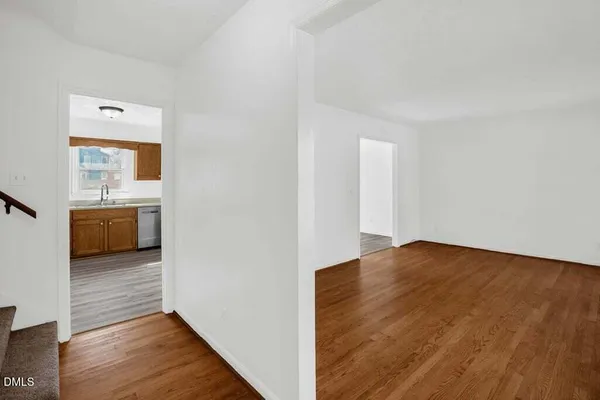 a view of a hardwood floor in a room
