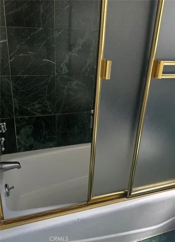 a bathroom with a sink and a window