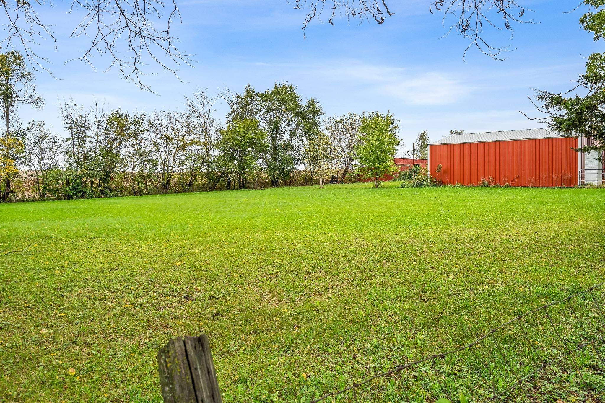 4304 Kendall Road Winnebago, IL 61088 - Photo 37 of 43 an outdoor space with trees in the background