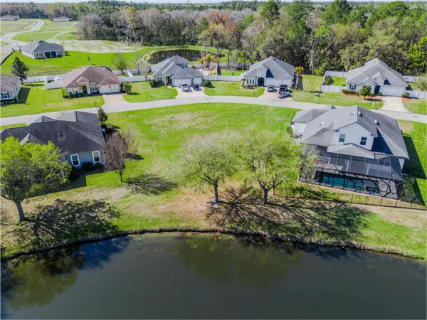 a view of a lake with a house in the background