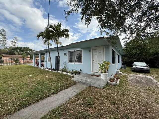 a house view with a garden space