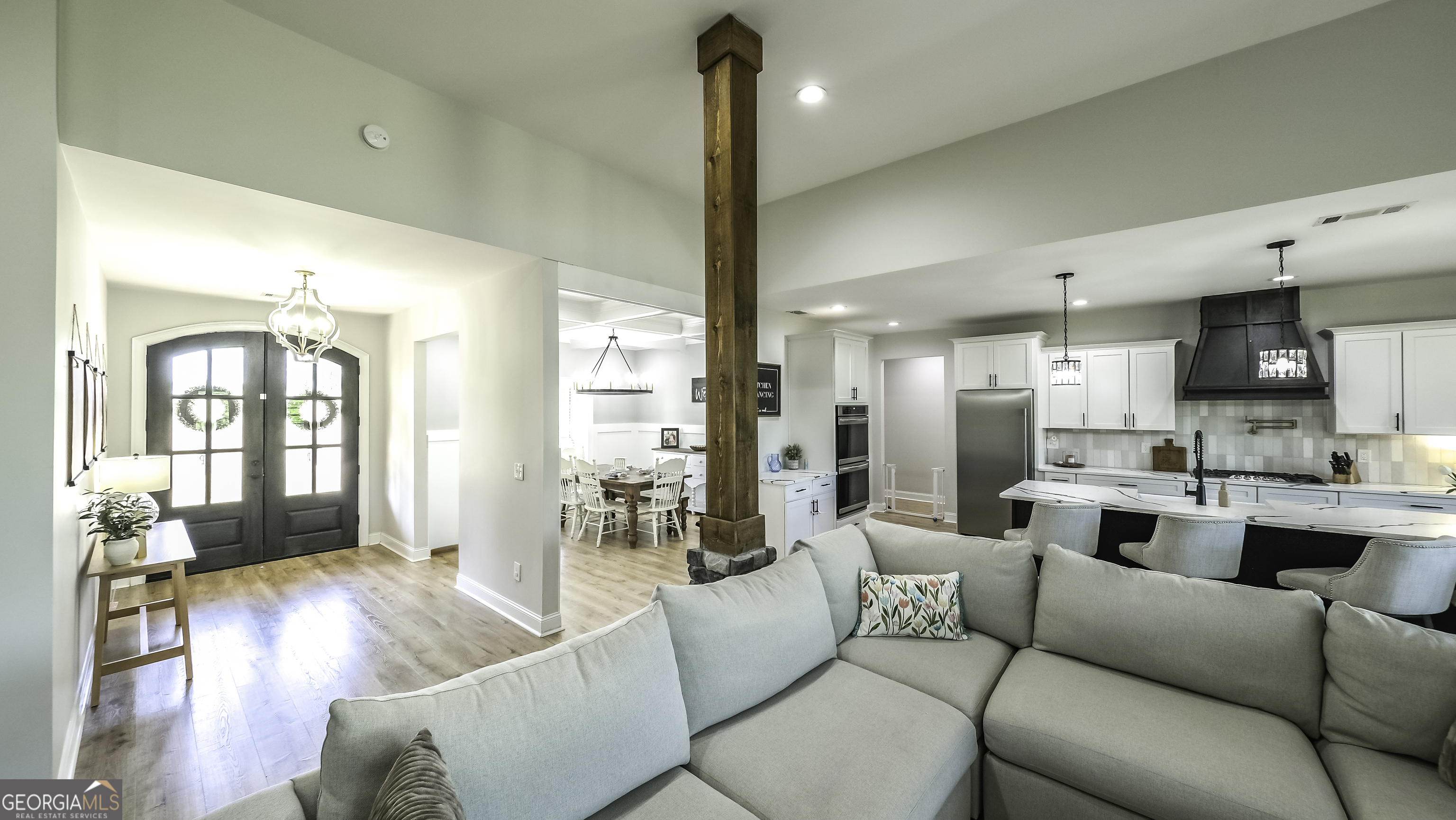 2392 Welcome Road Roopville, GA 30170 - Photo 19 of 43 a living room with furniture kitchen and a wooden floor