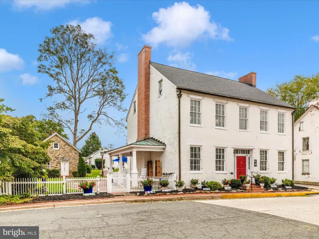 a front view of a building with street view