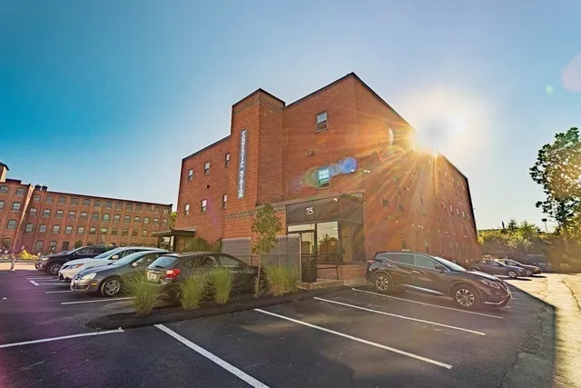 a view of a street with cars