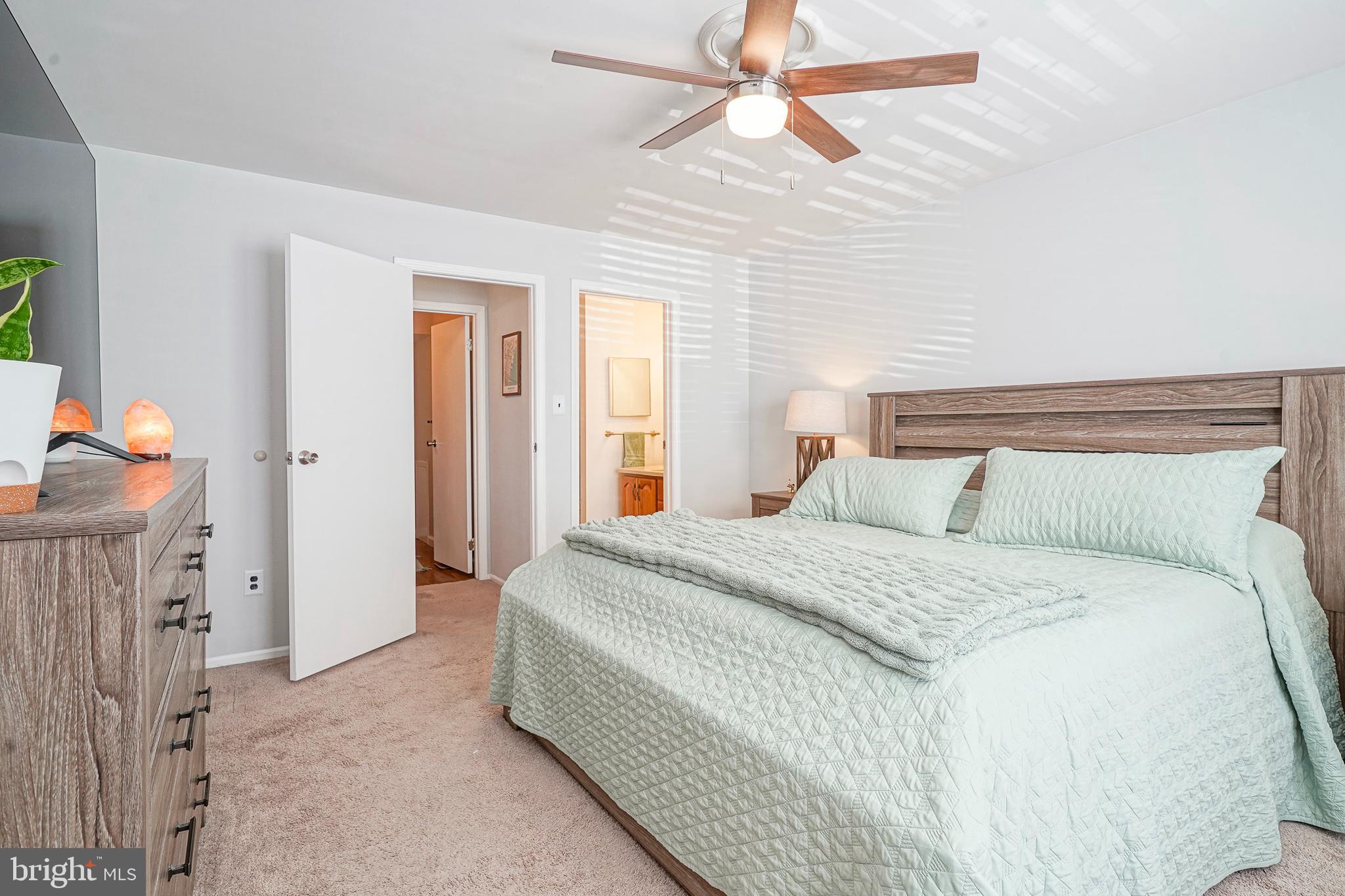 5 Kent Place Sewell, NJ 08080 - Photo 19 of 28 a bedroom with a bed and a chandelier