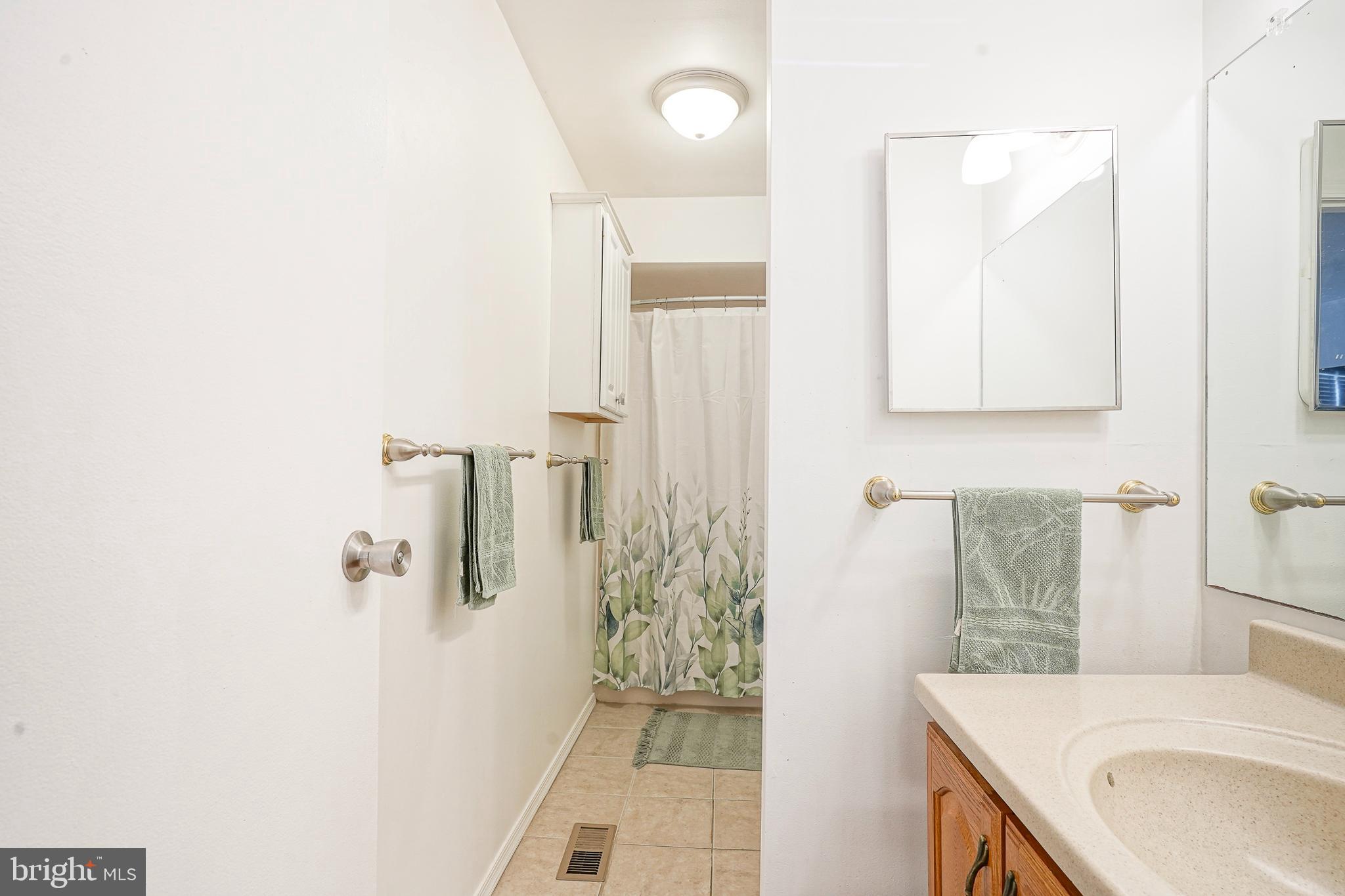 5 Kent Place Sewell, NJ 08080 - Photo 22 of 28 a bathroom with a sink a toilet and shower