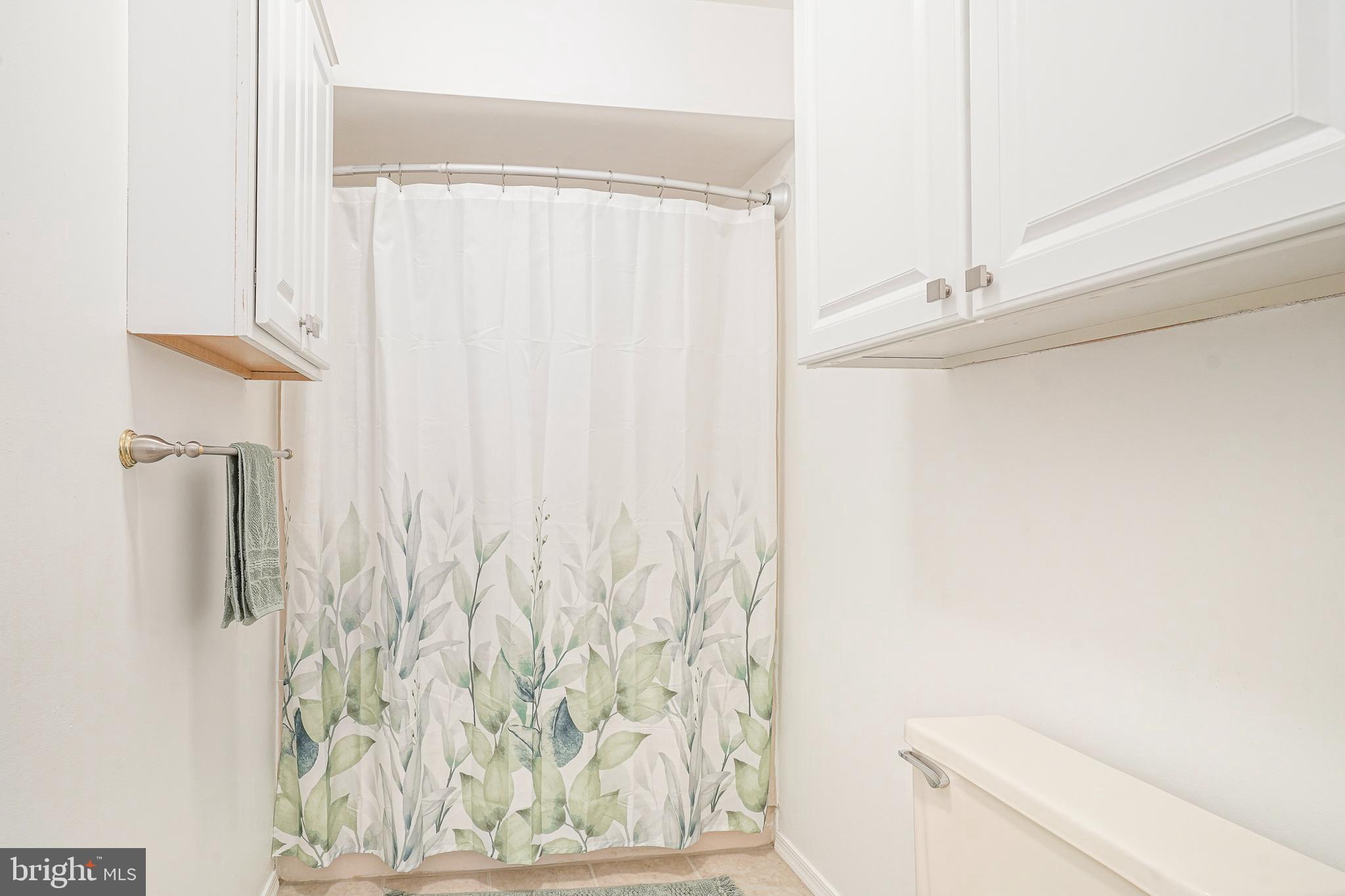 5 Kent Place Sewell, NJ 08080 - Photo 23 of 28 a bathroom with a shower curtain and a toilet