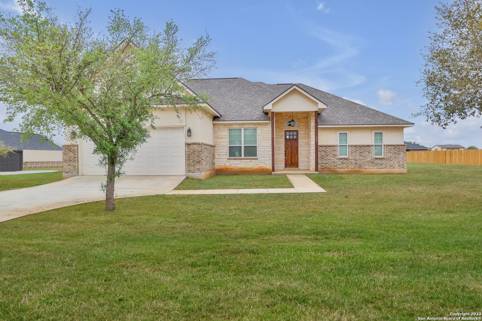 a view of a house with a yard