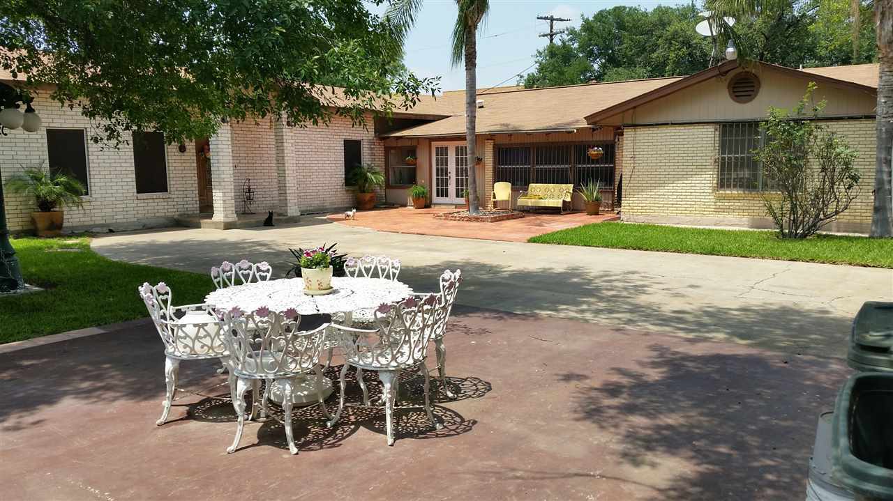 2619 Mier Street Laredo, TX 78043 - Photo 2 of 10 a view of a patio with table and chairs near a yard