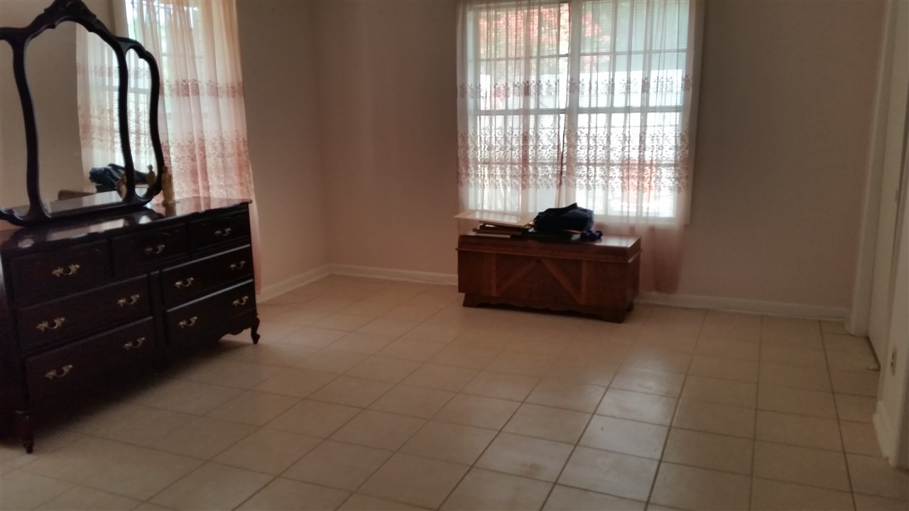 2619 Mier Street Laredo, TX 78043 - Photo 4 of 10 a room with a dresser and a window