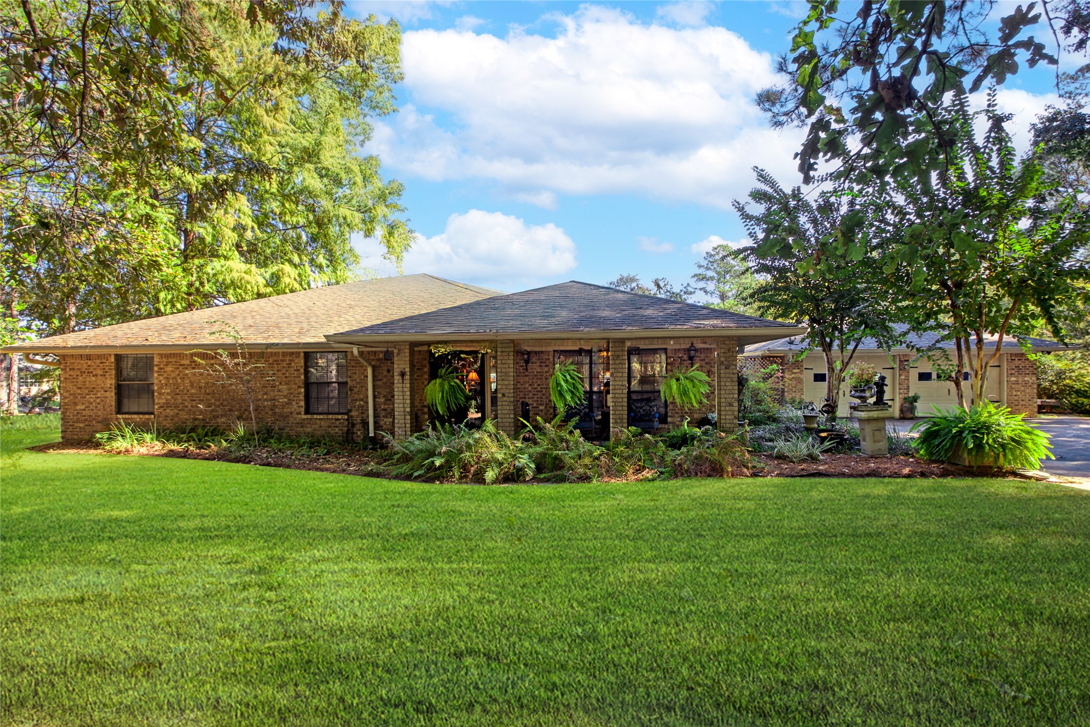 89 Heatley Street Trinity, TX 75862 - Photo 2 of 49 a front view of a house with a garden