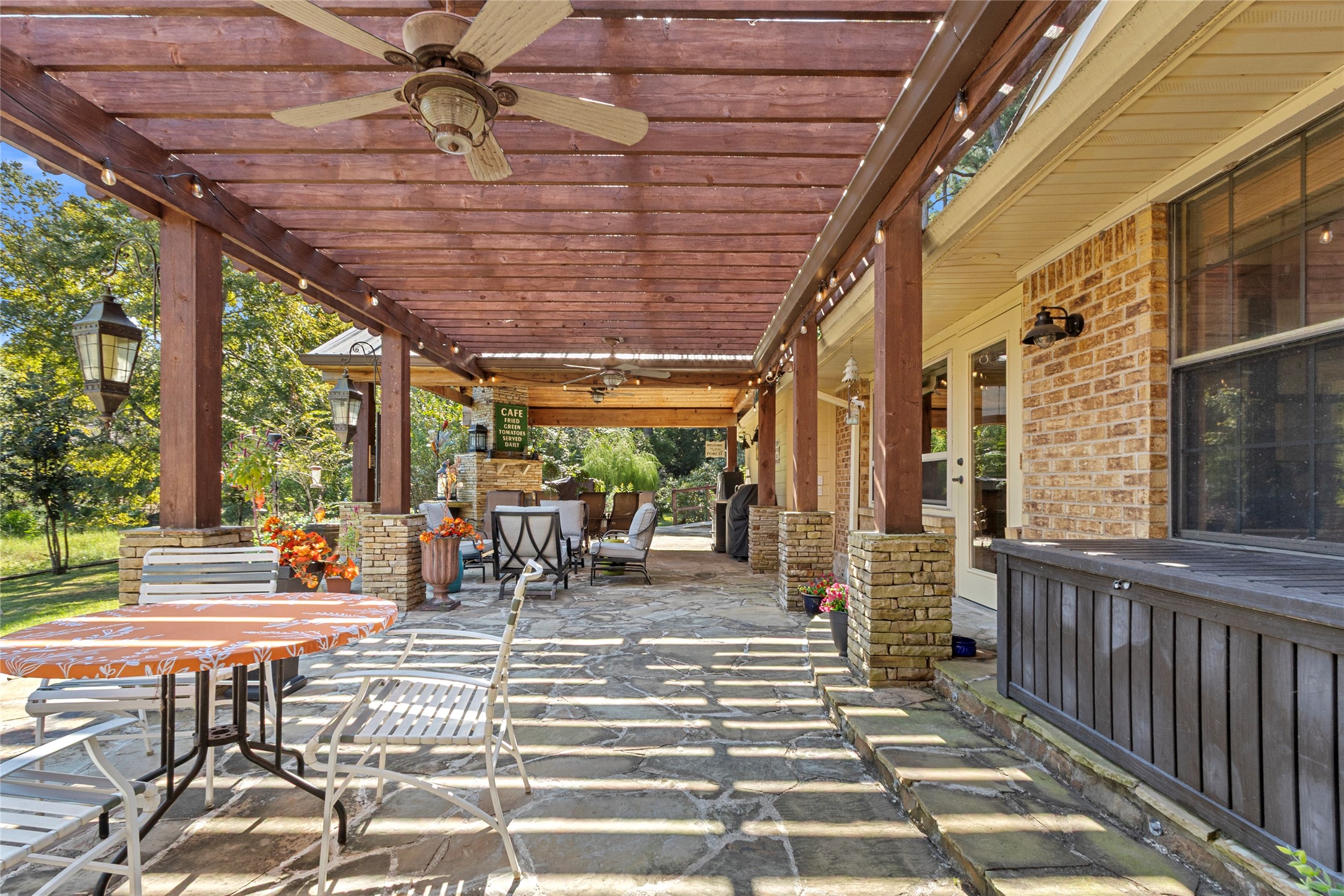 89 Heatley Street Trinity, TX 75862 - Photo 39 of 49 a view of a patio with table and chairs and wooden floor