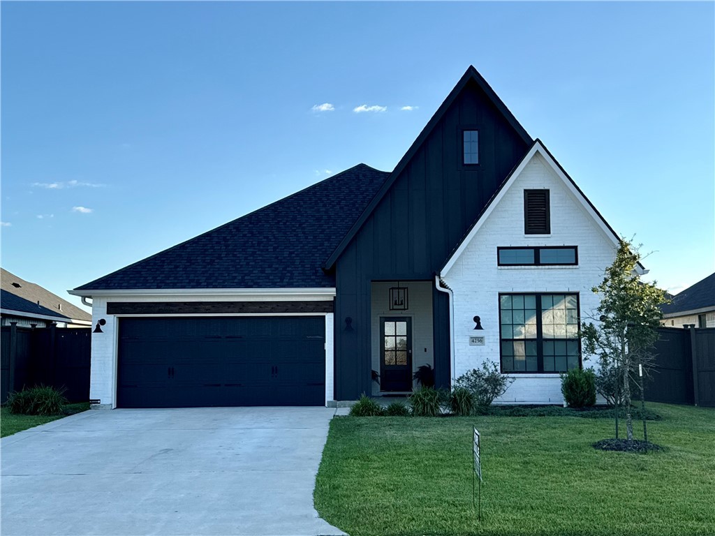 4256 Harding Way Bryan, TX 77802 - Photo 1 of 1 Modern inspired farmhouse with a garage and a fron