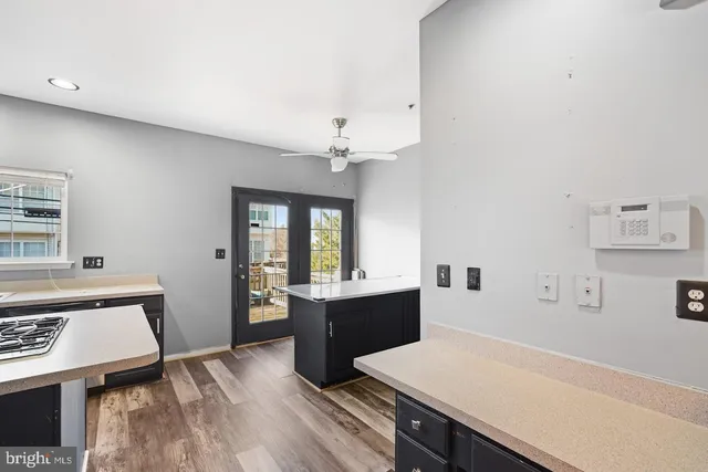 a view of a kitchen with a sink cabinets and wooden floor