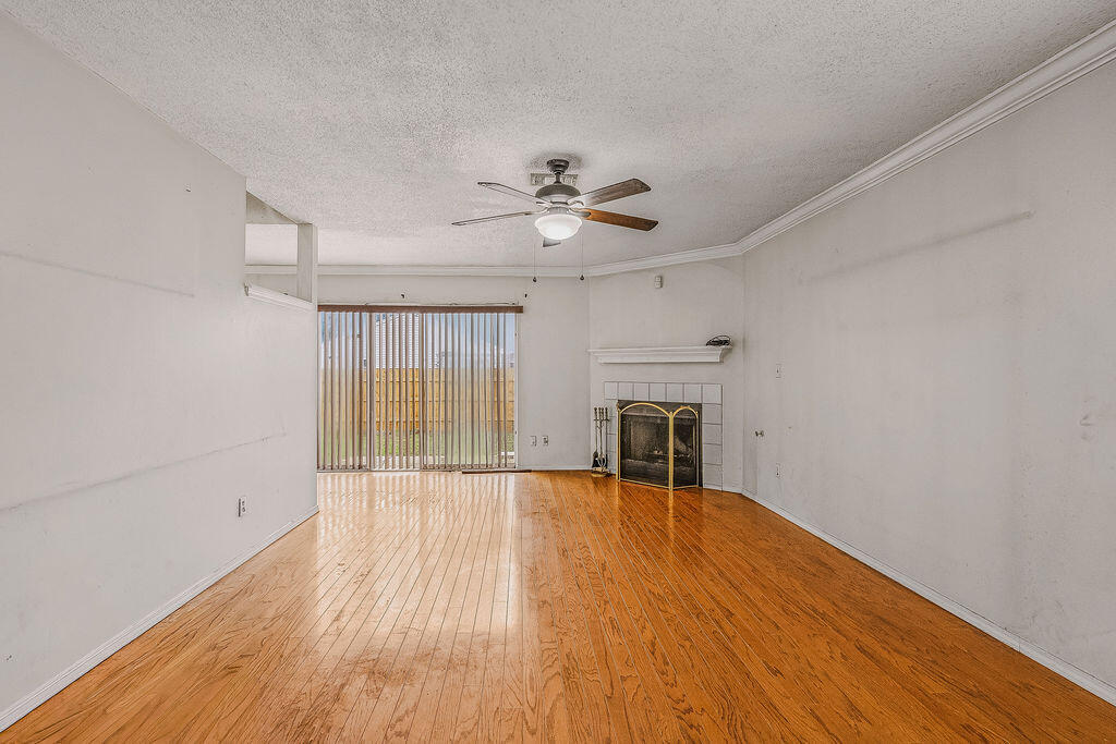 53 4th Street Shalimar, FL 32579 - Photo 4 of 47 wooden floor in an empty room with a window
