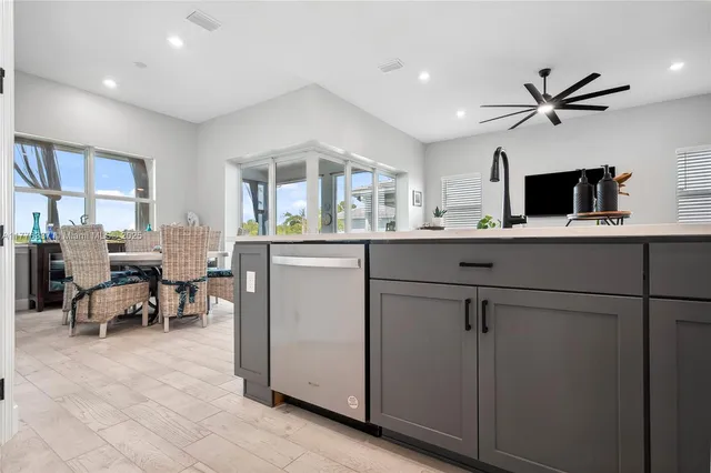 a kitchen with counter top space cabinets and stainless steel appliances