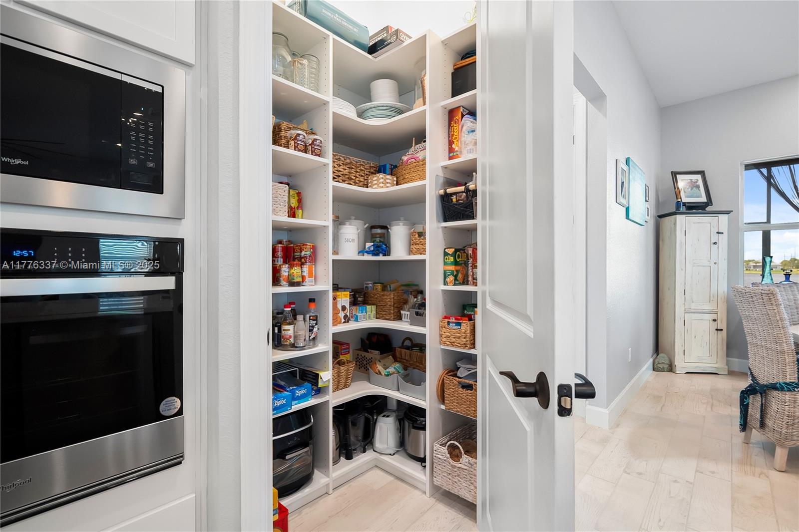 9734 Southwest Meridian Way Stuart, FL 34997 - Photo 12 of 48 a view of a living room and a flat screen tv