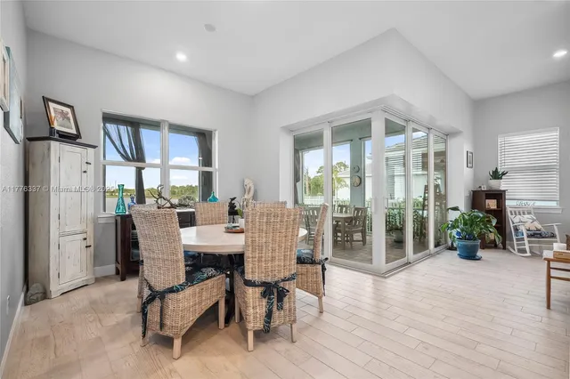 a dining room with furniture wooden floor and a rug