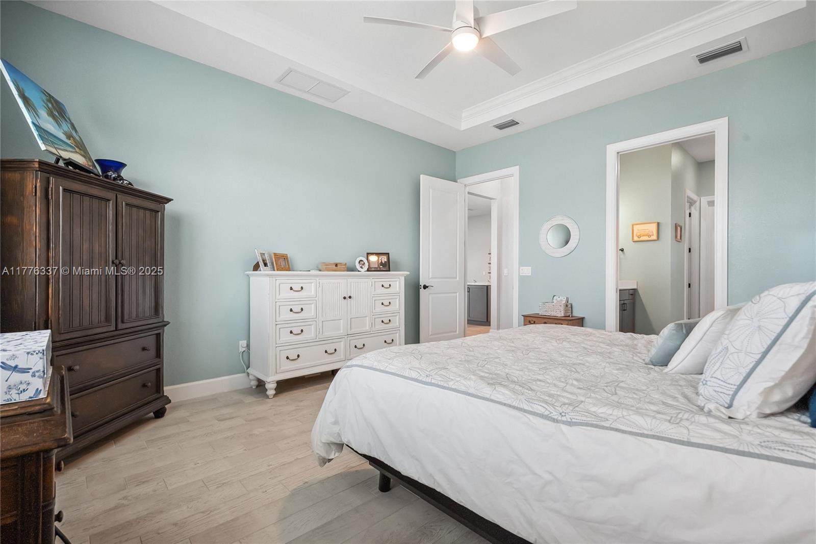 9734 Southwest Meridian Way Stuart, FL 34997 - Photo 19 of 48 a bedroom with a bed and furniture