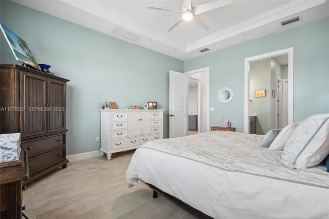 a bedroom with a bed and a cabinets