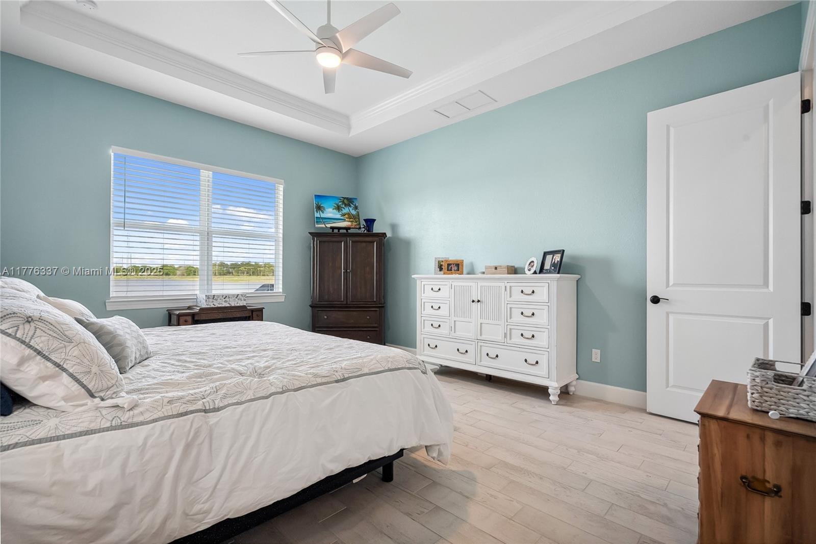 9734 Southwest Meridian Way Stuart, FL 34997 - Photo 20 of 48 a bedroom with a bed and a window