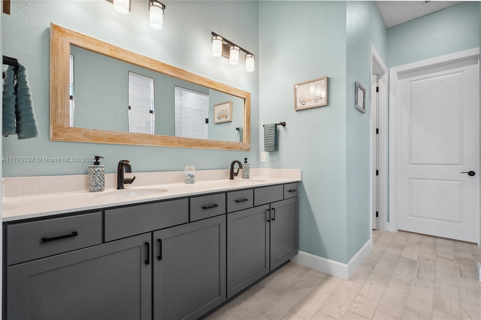 9734 Southwest Meridian Way Stuart, FL 34997 - Photo 21 of 48 a spacious bathroom with a double vanity sink mirror and