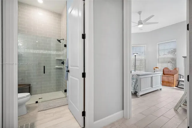 a bathroom with a tub shower and sink