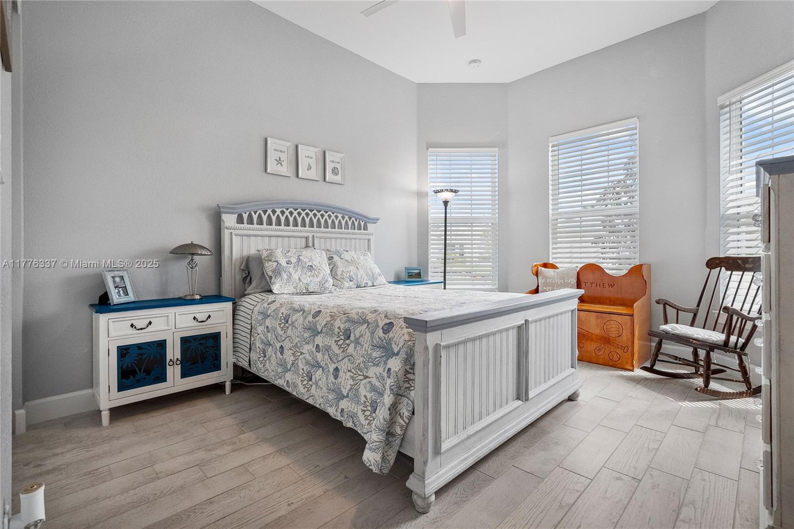 9734 Southwest Meridian Way Stuart, FL 34997 - Photo 29 of 48 a bedroom with a bed and a couch