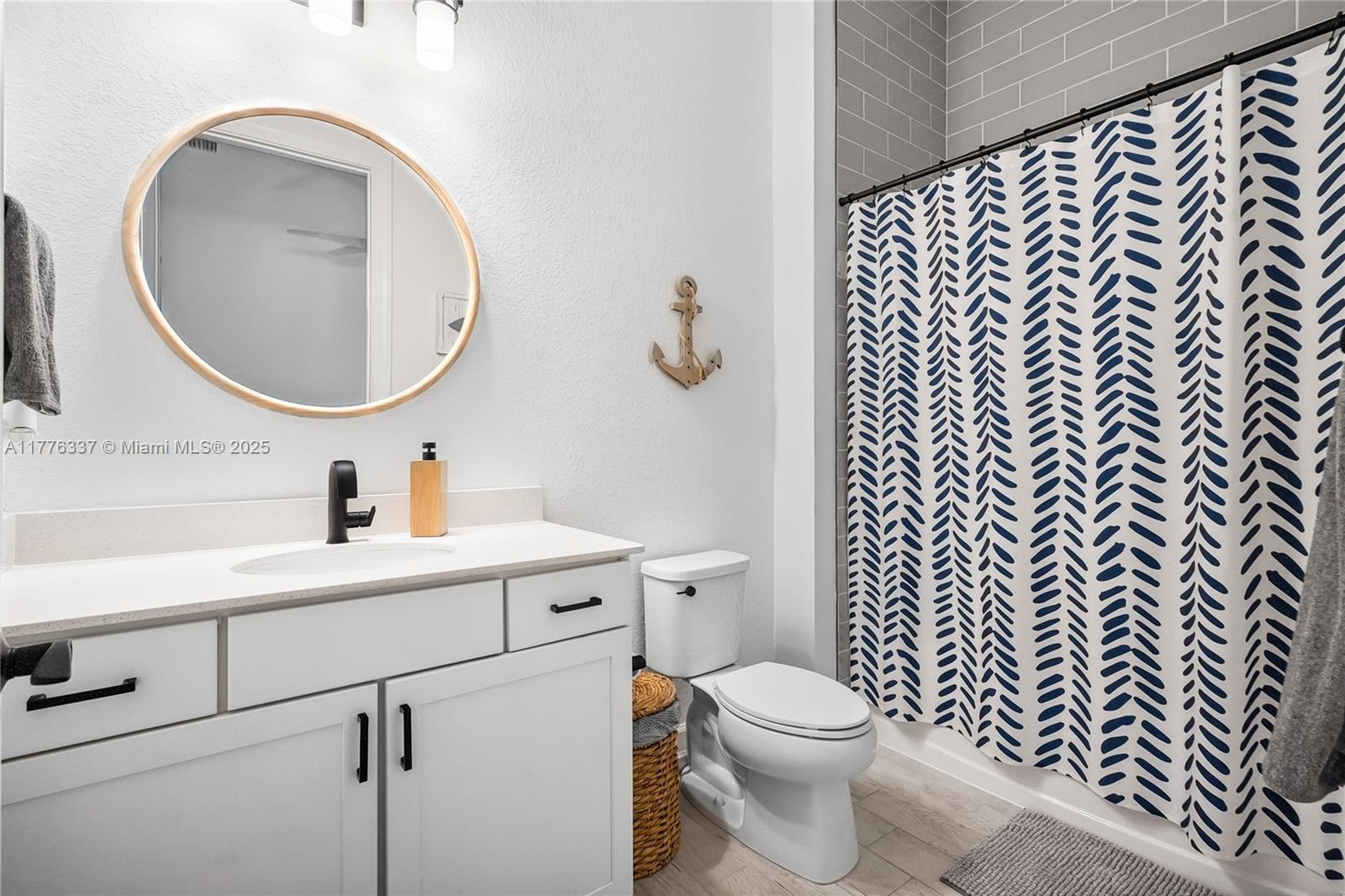 9734 Southwest Meridian Way Stuart, FL 34997 - Photo 30 of 48 a bathroom with a toilet a sink a mirror and vanity