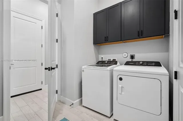 a view of storage and utility room with washer and dryer