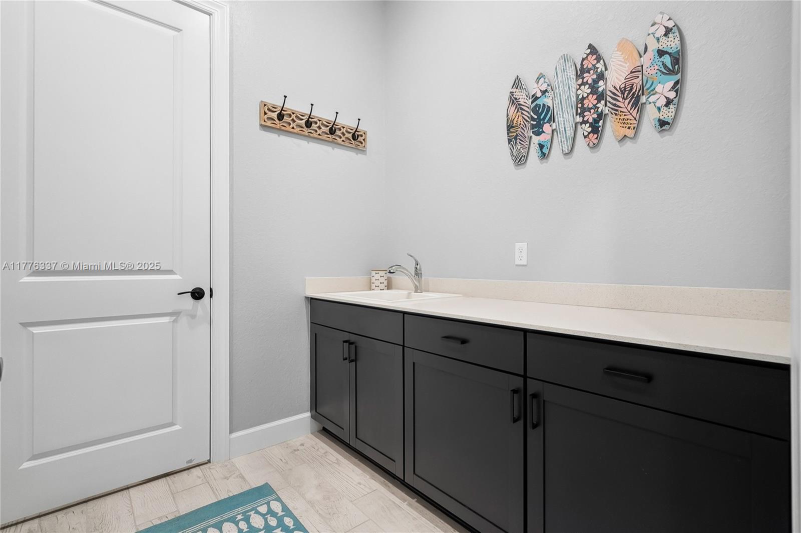 9734 Southwest Meridian Way Stuart, FL 34997 - Photo 32 of 48 a bathroom with a sink and a mirror